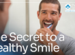man brushing teeth in the mirror