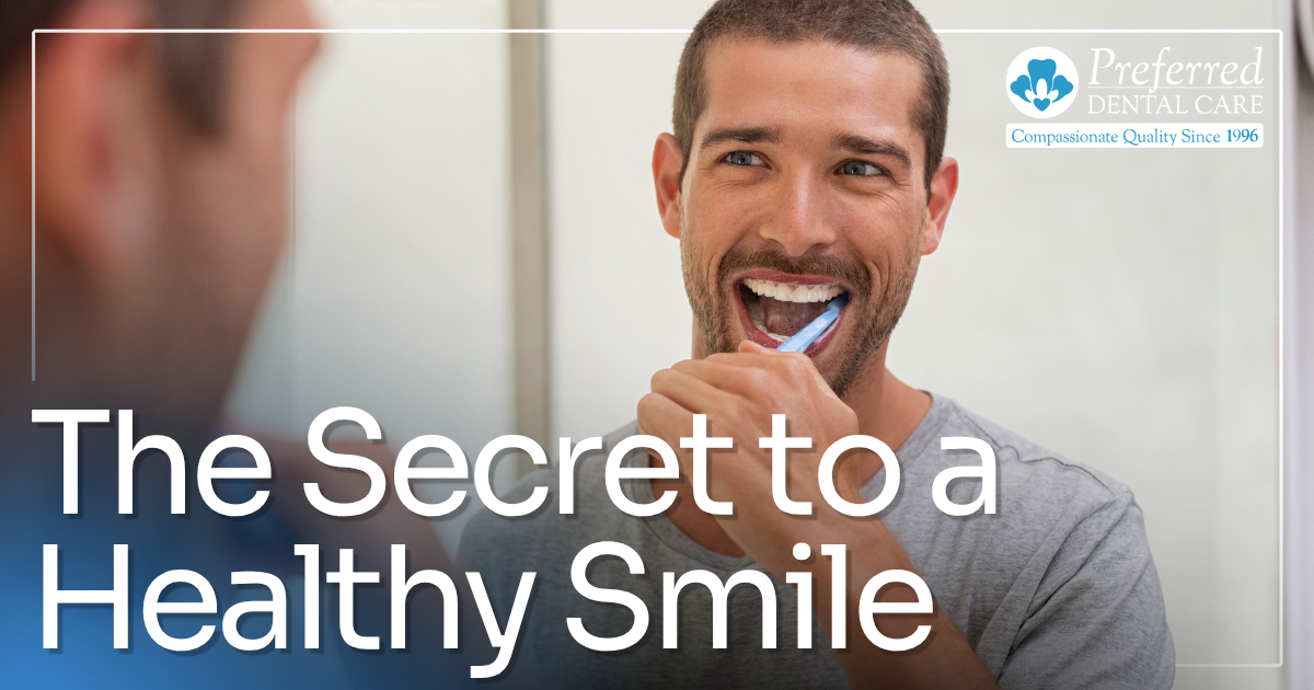 man brushing teeth in the mirror